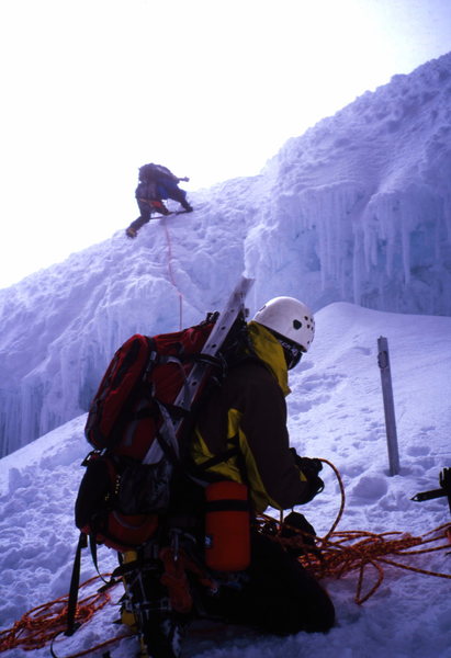 me belaying Jon down and across the upper schrund, Cotopaxi, Ecuador. photo. Hans