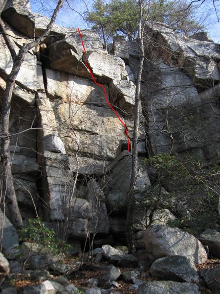 Core Shot (line).  Also visible is "Shotty Not", the squeeze offwidth that starts at the right side of the boulder pile and ends at the pine tree (5.5 or 5.6).