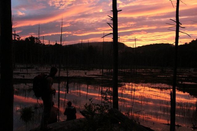 Surprise sunset after a rainy day at Pawtuckaway. Jenny, Jason, and Patrick. July 2010.