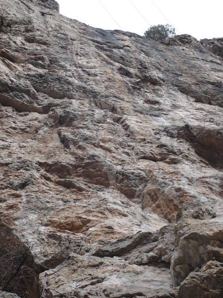 The Long Haul pulls into the tan corner above the ledge and goes straight through the small corners to the tan streak on the head wall.