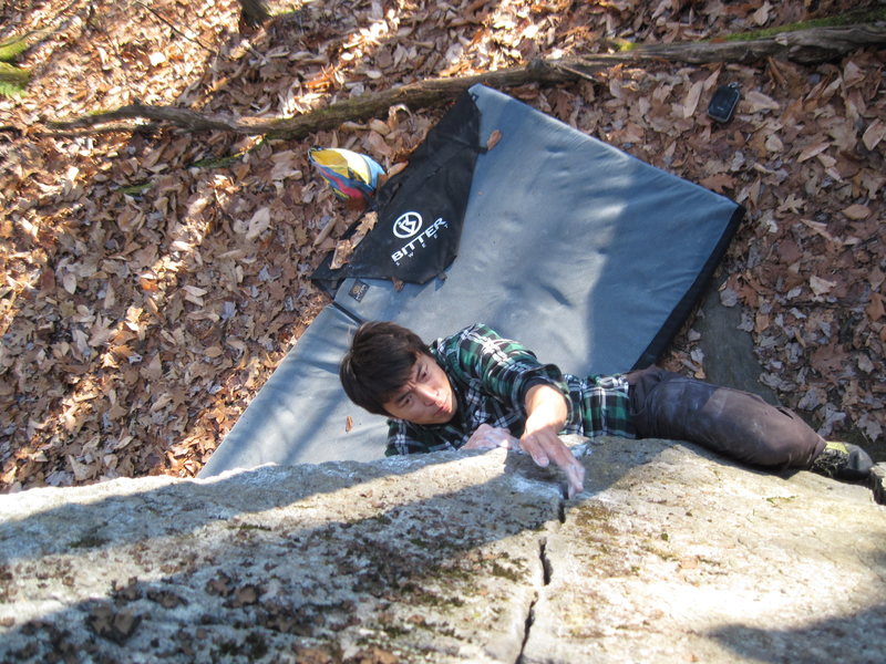 Fan sticking the crux move into the slot on PBR, a Rumney lowball classic!