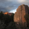 One of the Anvil Boulders at sunset. A hand full of tall problems summit this boulder, including the Nopinyon Arete on the left, and Wordman, the arete partially obscured by the tree. 