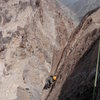 Delicate, bolt-protected face climbing on the summit pitch- the technical crux of the route.