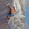 Almost through the 2nd crux of Slap My Fro at Winslow Wall.  Photo by Chris M.