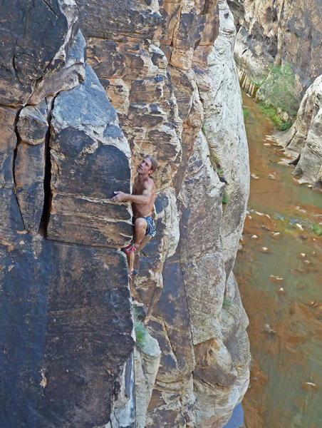 Topping out on Slap My Fro (12b) at Winslow Wall.  Photo by Chris M.