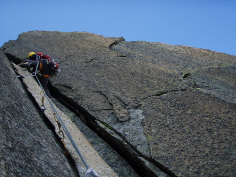 The alternative to the crux 7a pitch of Conquest, ascending a splitter flake followed by a short chimney.