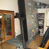 My "Ascent Fun Rock" rotating climbing wall wedged into our "Florida Room".