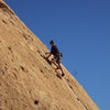 A climber above the crux of "Aenea."