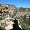 my wife kickin' back on picnic ledge at the end of pitch 3, taking in the view of Call of the Canyon.