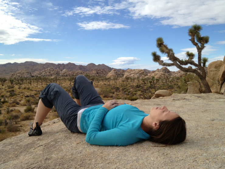 A reclined Ines enjoys a rest atop the Asteroid boulder