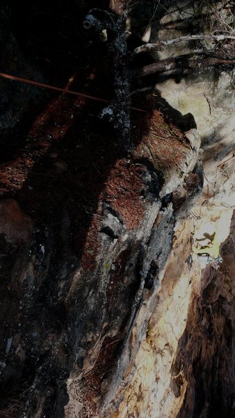 Sammy one move above the crux in the broken crack. 