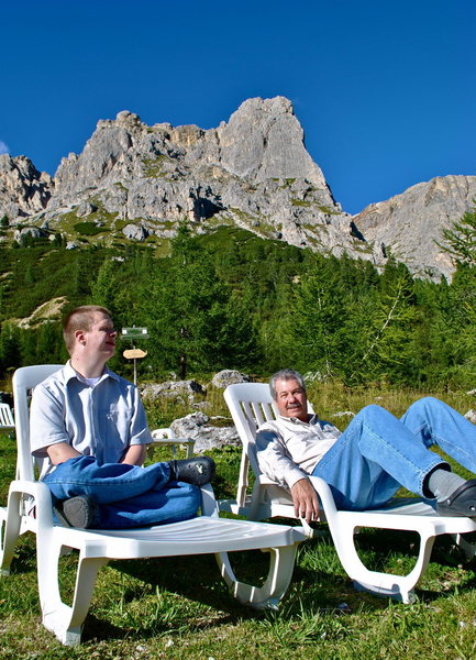 Lawn chairs at the resturant and parking lot for the Falzarego Towers.  The 'Comici' in the background.