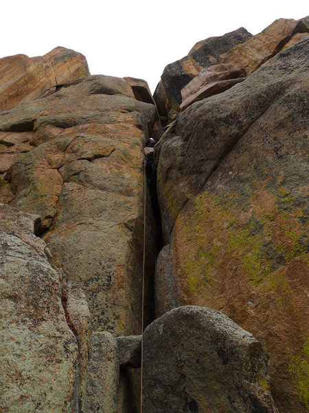 Great chimney start (only good pro is at the level of the large chockstone just below the belay). Better to set the belay a bit higher after the next easy section to decrease rope drag and have a visual of the leader on the crux.