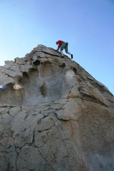 Chris high up on the Hueco Boulder