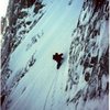 Jeff Burton on upper part of snowfield leading into base of the N.Q. Couloir, April 1992.