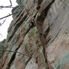 Reese Mtn Douglas Park.  Freddie leads Aeolius 12b.  Note the free hanging rappel line.