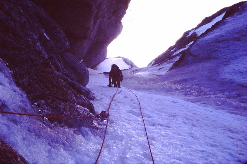 Black Ice Couloir, Summer of '82?<br>
<br>
Three ice tools total, one Salewa screw, one wired stopper and one piton, 8mm rope. Perfect rack!<br>
<br>
Bret Olson wearing shorts and Super Gaiters.<br>
<br>
One day trip from Rexburg, even after I spent a few hours in jail in Jackson while Bret came up with the $80 cash to pay the speeding ticket.  Jackson Cops - bad boys, bad boys, what ya gonna do!
