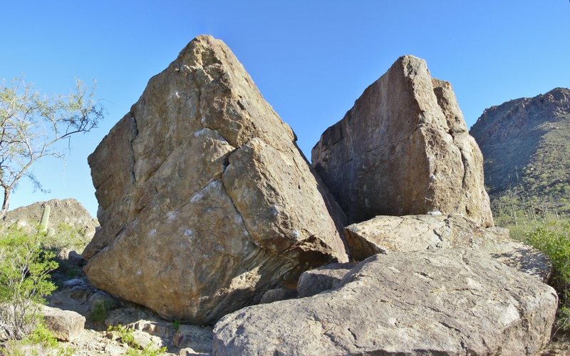 North face of the Broken Rubber Boulder (left), north face and arete of the Main Lower Boulder (right).