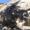 On the jugs, just past the crux.<br>
<br>
Photo by Cory Barnes.