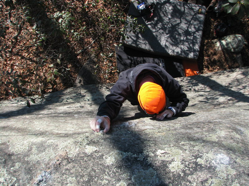 Orange Man crystal pinching up the steep slab
