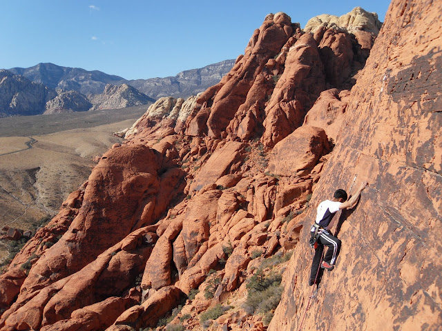 My friend Raj on the route - it is nice and airy for a 5.8 and one of the best views you can have doing sport in Red Rocks