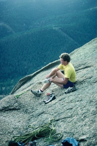 Brian Hansen getting ready to run for shelter from a storm after topping out on the first ascent of Childhood's End.  Lightning hazard kept us away from the summit rap bolts for about an hour.