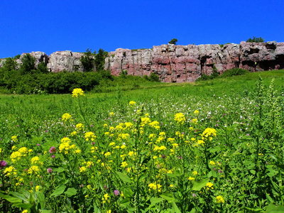 Prairie Walls area with climbers on Cussin' Crack and Balcony Center