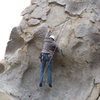 Richard Alden, hanging the pre-crux move above the dish on Pancakes and Cornflakes.