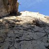 As a note of caution, there is a death block (+/- 150lbs) about 30 feet up on the left side of the route, just above the shadows in this picture.<br>
(Update: climbed this route again in October '12. The large loose rock has been removed.)