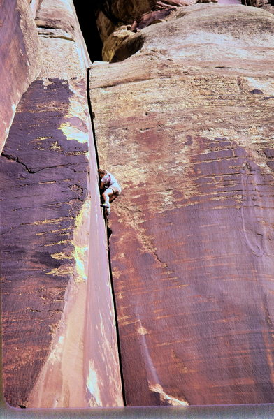 Scott Woodruff leading a classic dihedral at Indian Creek in the late 70's. <br>
Photo: Olaf Mitchell<br>
Before friends were invented it was an entirely different game all together