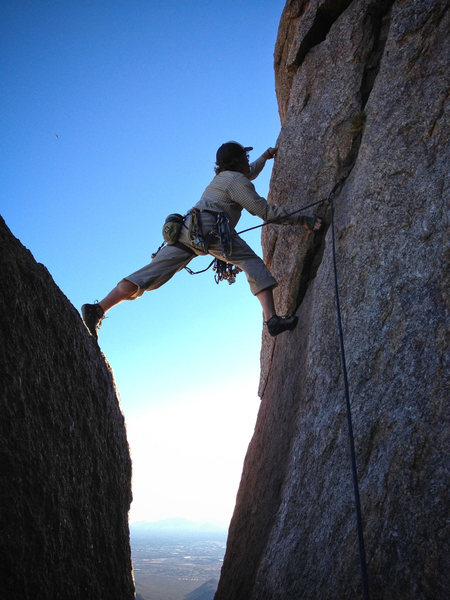 Travis climbing Tom's Thumb.