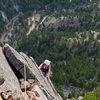 Finishing the airy arete on the Joan variation.