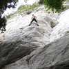 Climber on the classic Sotto L'Edera at the main cluster of routes at Settore Sinistro