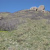 Approach beta photo 2. Looking up at Hadrian's Boulder (left side of photo) and Hadrian's Wall (right side of photo) from the spot on the Bonneville Shoreline Trail where you need to start heading up the slope.