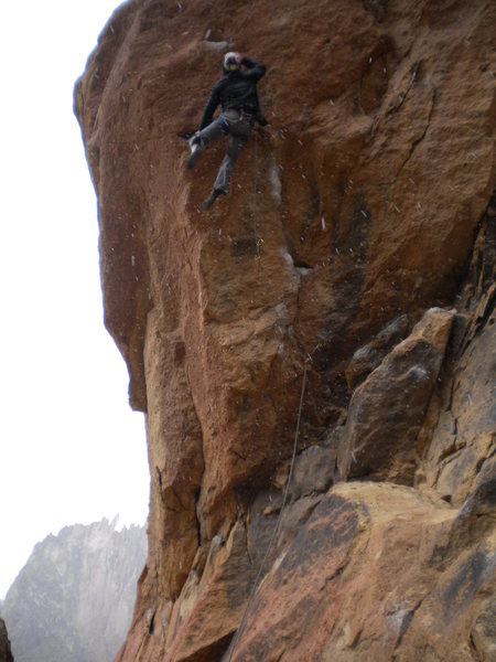 Pulling the crux for a short person involves an all points off dyno.