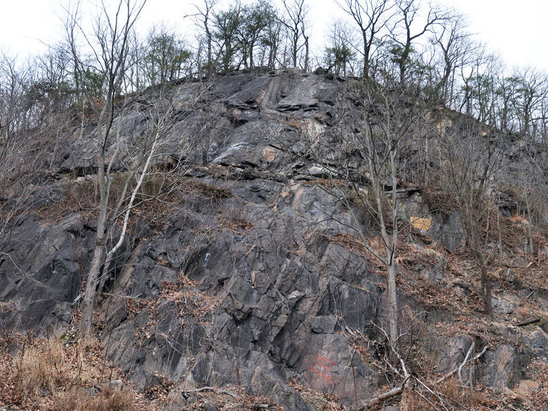 The main climbing area starts half way up at the horizontal shelf.