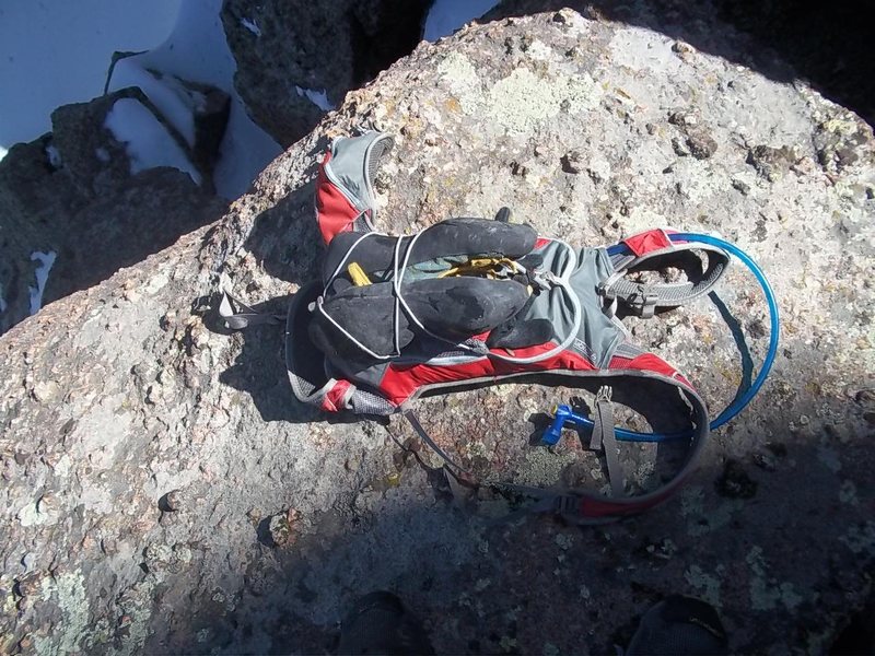 Climbing shoes attached to running pack.