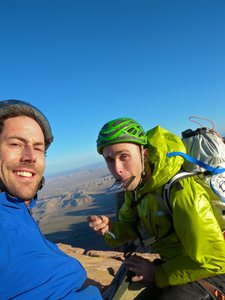 On top with the summit register and high winds.