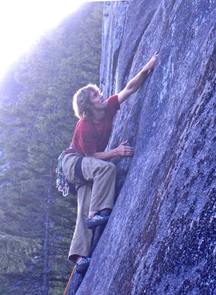 Michal moving into the flaring thin hands section after the crux (House of the 7th Bobcat). 