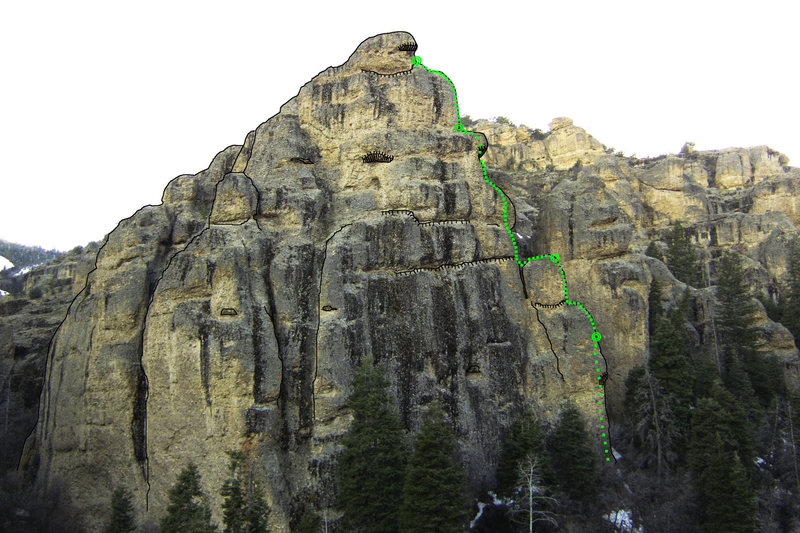 Dizzy Rock as viewed from the Schoolroom parking area. <em>The Dizzy Channel</em> starts out of sight at the base of the arete.