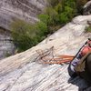 looking down while hanging off huge jugs partway up the stellar and very juggy second pitch.