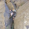 Taylor Roy on the amazing 3rd pitch.  Climb nice fingers and face holds to the top of a pillar.  Tackle an 8 foot 5.9 wide section with fingers deep in the crack, and scramble up a 5.6 slab until the wall steepens.