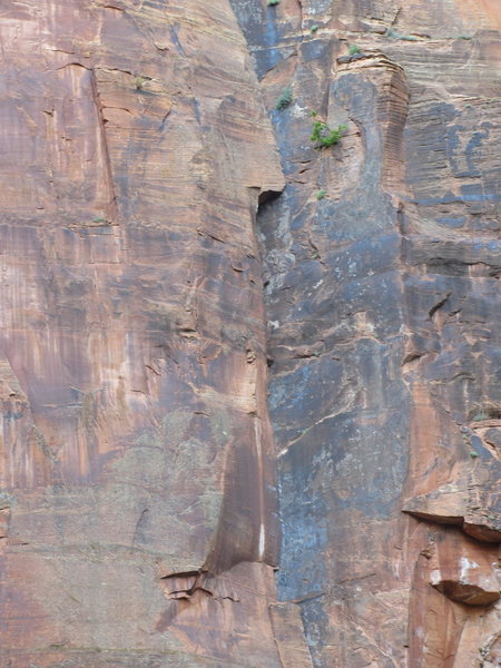 A close up of the crux third pitch and fourth pitch roof from the road.