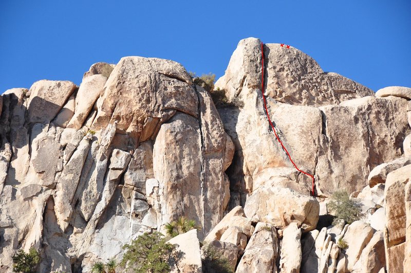 Crack Highlighted in Red. Note the fixed anchors with rap rings to the right of the climb.