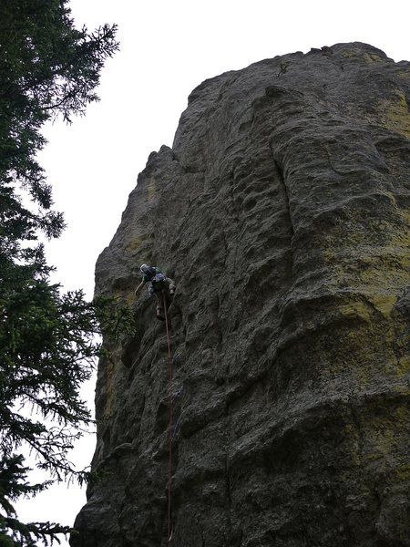 Photo is a little dark but shows you can climb straight up the face, more or less, until the ledge.  Well protected.  Probably the first time I got pumped on a 5.7, trying to figure out what to do next.  