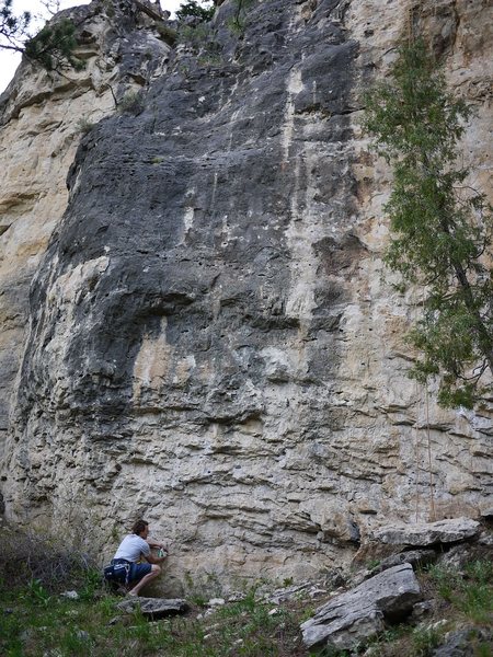 This route climbs the face immediately to the right of the 10a that is the left most route.  Or, inbetween where Jay is and the rope is hanging.  