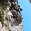 Greg takes a well-deserved rest midway through the crux section of the climb