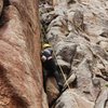 Sarah approaching the crux on First First.