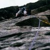 April 5th 1988. Looking up P2 of Lands End from the belay. Mark Taylor on the lead.