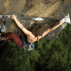 Jess spanning thru the roof traverse.<br>
Photo:Dan Brayack